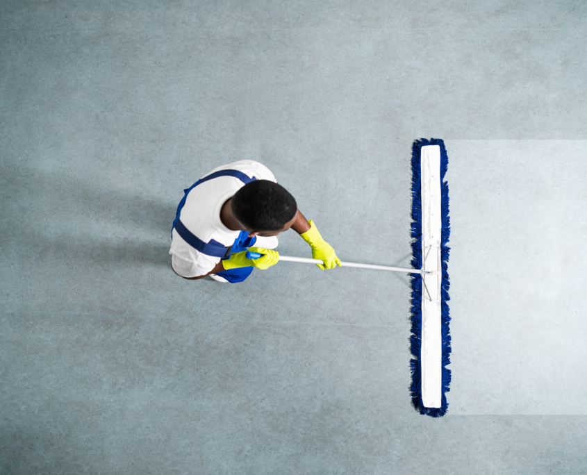 Bird's Eye View Of Janitor Cleaning Floor