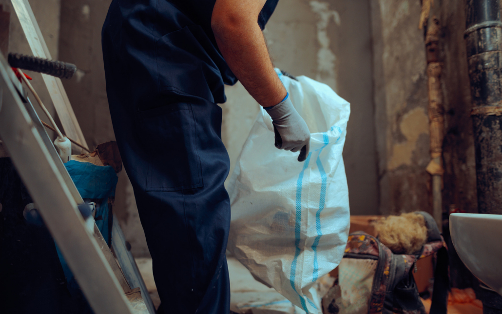 Construction Worker Handles A Heavy Duty Debris Bag