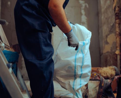 Construction Worker Handles A Heavy Duty Debris Bag